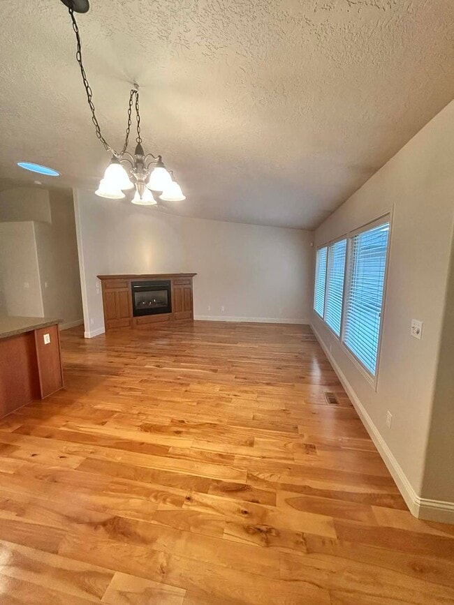 Building Photo - Spacious Duplex with 3-Car Garage & Private Patio!