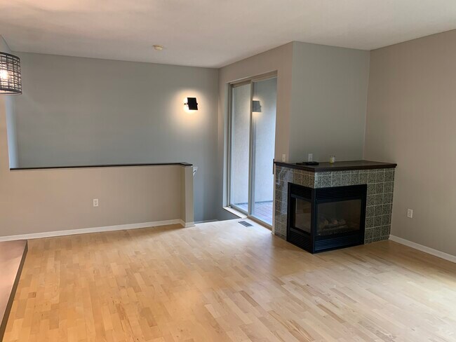 Gas fireplace, doors to deck and stairs down to bedrooms - 645 N 1st St