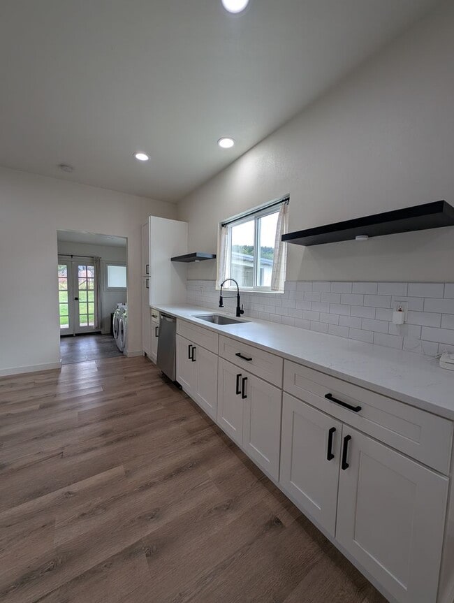 Building Photo - Adorable Four Bedroom w/ Fenced Yard Avail...