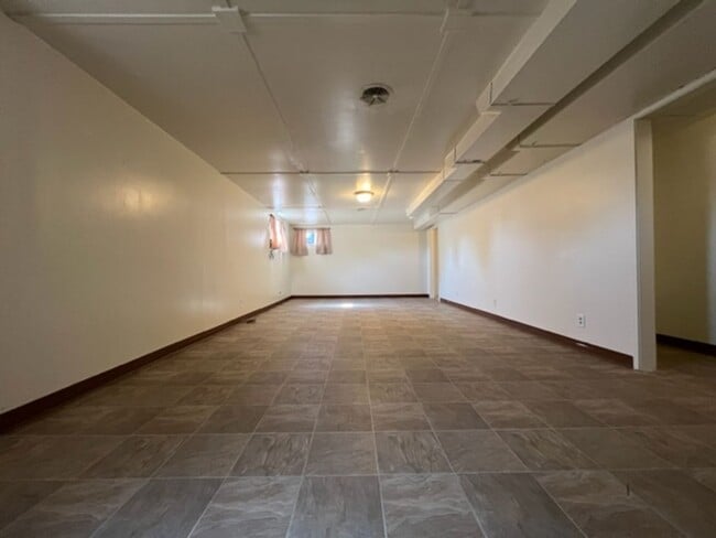 Building Photo - Bi-Level House w/ Massive Backyard, Storage, & Character!