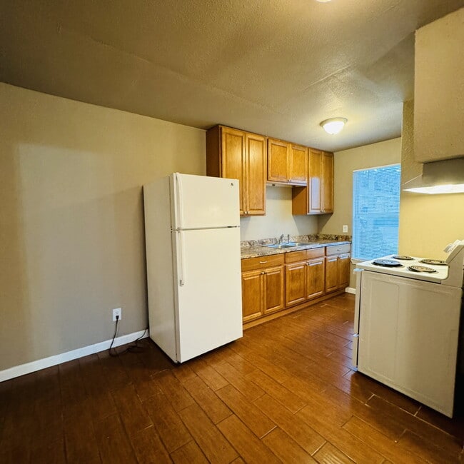 Building Photo - Welcome to Pine Shadows Duplex Apartment