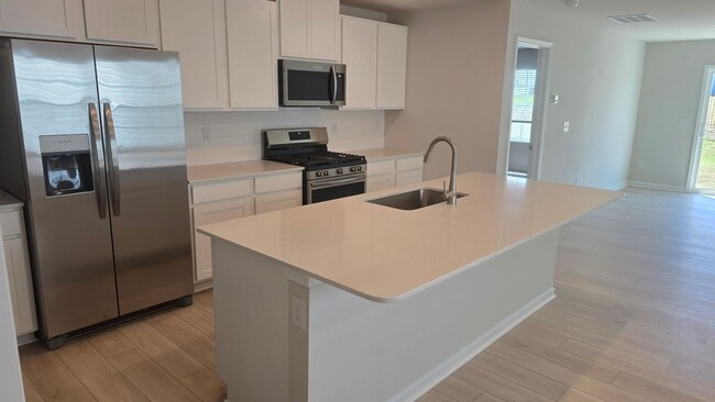 Building Photo - New Home with 5BR/2.5BA, Loft Area, Primar...