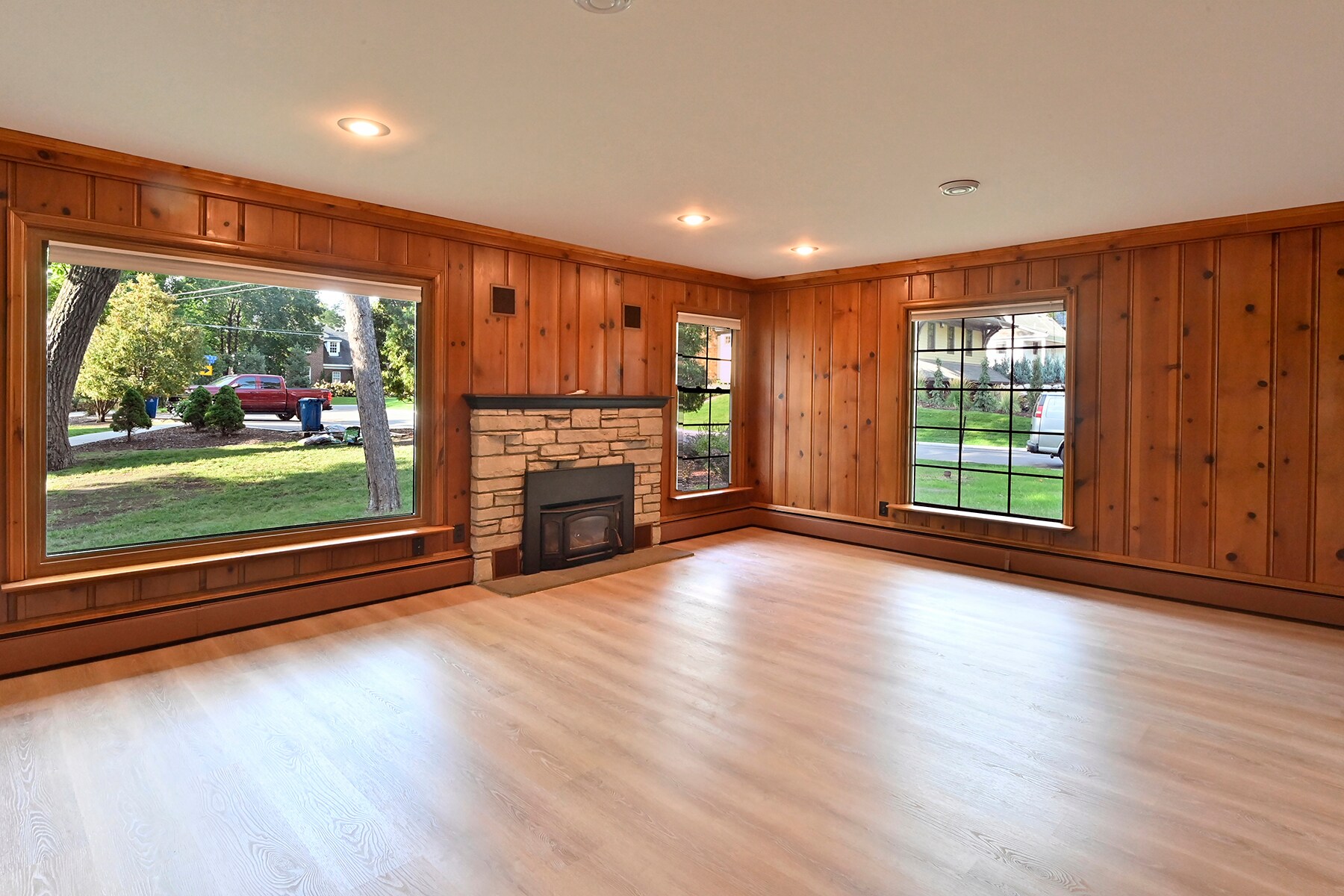 Living room view with picture windows and fireplace - 330 Central Ave S