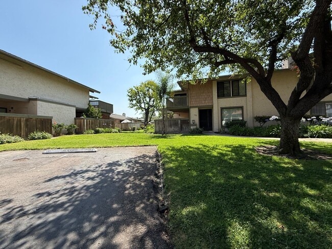 Building Photo - Spacious & Stylish Mission Plymor Townhome! 2 Assigned Parking! AC!