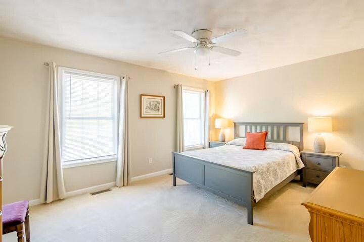Bedroom has 2 walk in closet and ceiling fans along with blinds and curtains. - 515 School Ln