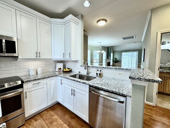 Building Photo - READY NOW!! End-Unit Loft-Style Condo w/1s...
