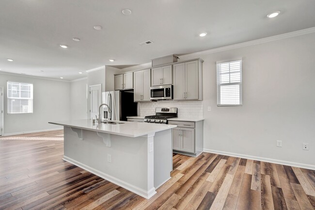 Building Photo - BRAND NEW BEAUTIFUL TOWNHOME IN GROWING AP...