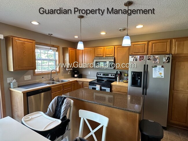 Building Photo - Lakeville End Unit Town Home, 2 Car Garage, 2.5 Baths, Walk out Patio, Available July