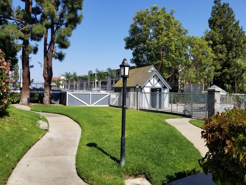 Main grassy area & Pool bathrooms - 3028 W Cheryllyn Ln