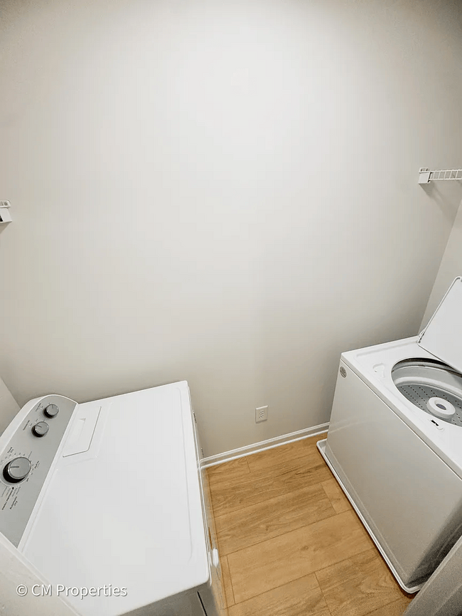 Laundry room with new washer and dryer upstairs. - 3968 Boston Common St