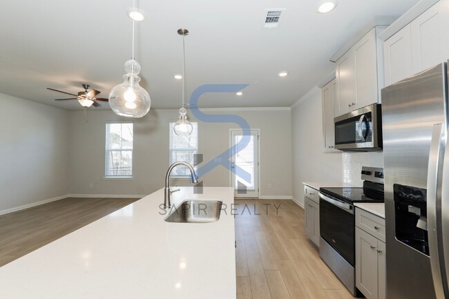 Building Photo - Move in before February 28th and choose your reward: a $250 Amazon Gift Card or a 55" Smart TV!