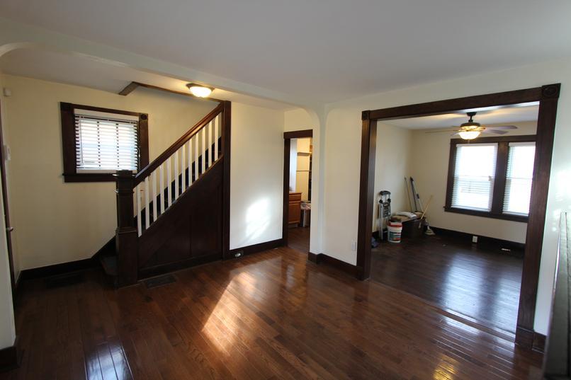 View from the family room into the dining room and stairs to second floor - 2038 Stonelea St