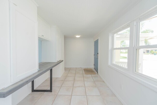 Building Photo - Live the ultimate Space Coast waterfront lifestyle at this stunning beachside canal home in Satel...