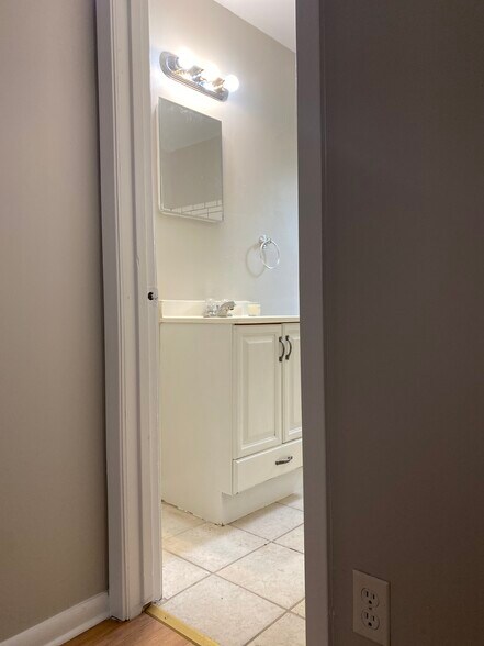 bathroom with new chrome bath fixtures - 4422 Bell St