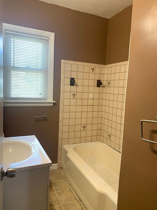 Building Photo - Three bedroom home with beautiful hardwood floors and central air!