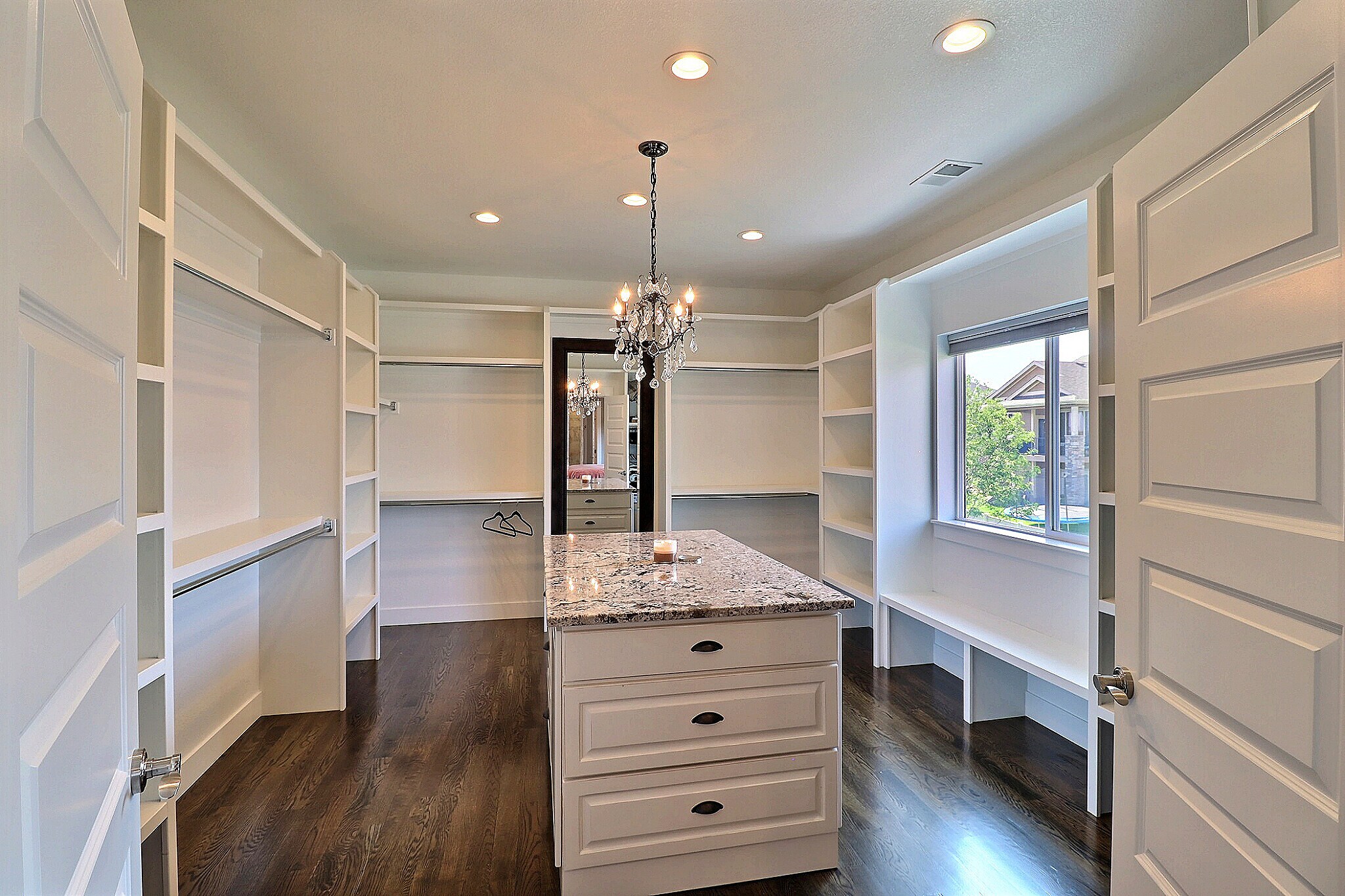 Large walk in Master Closet with center island, chandelier, and window seat - 9004 19th St
