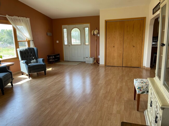 Building Photo - Spacious, four-bedroom, two-bathroom, coun...