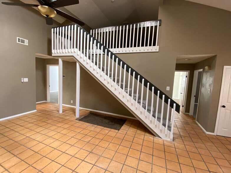 Living room view of stairs, loft &amp; hallways leading to bedrooms (master bedroom/bath left of stairs &amp; 1st bedroom, hall bath &amp; 2nd bedroom on the right of stairs) - 4528 Lanham St