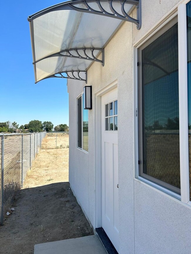 Building Photo - 9308 E Ave T 6