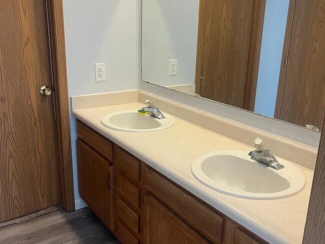 Building Photo - The home features beautiful LVP flooring, granite countertops, stainless steel appliances, and a ...