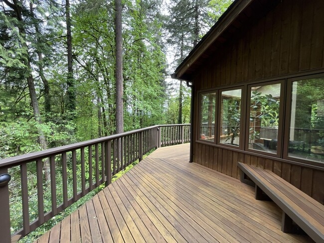 Building Photo - One-of-a-Kind Custom Home with Wall of Windows, Stone Fireplaces, Expansive Entertainment Space &...