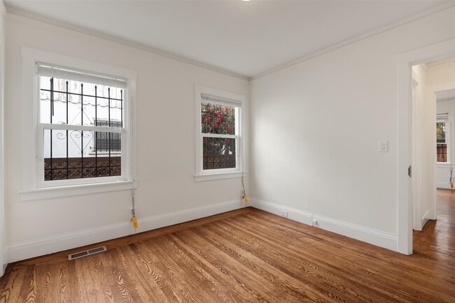 Another shot of the main bedroom with no staging. Look at that floor! - 2108 E 23rd St