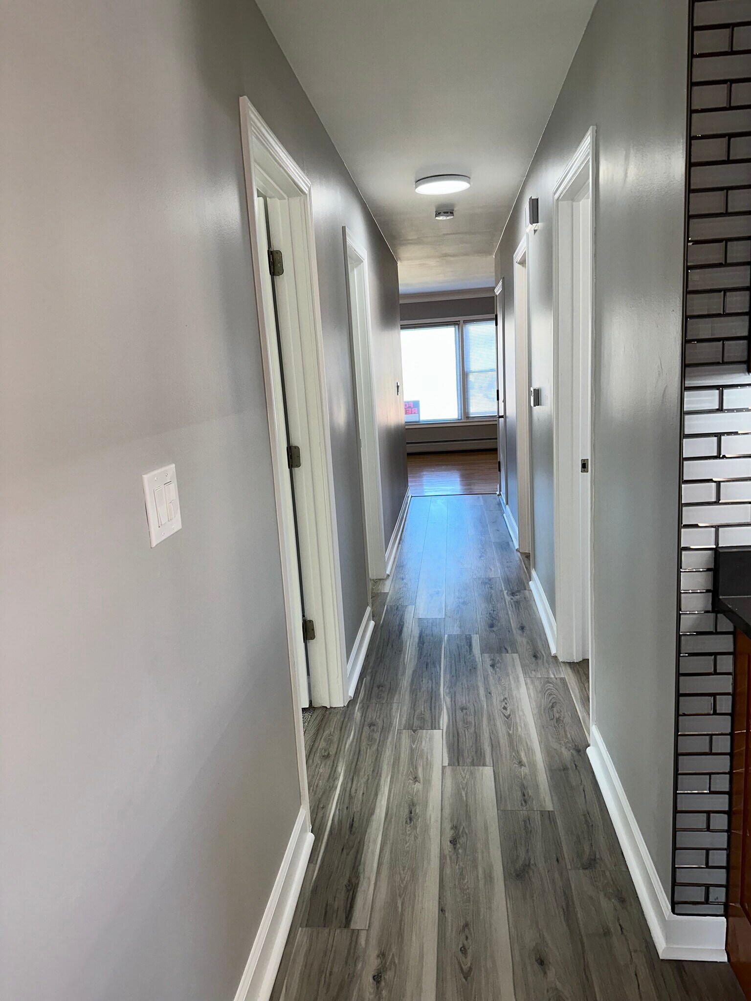 Solid plank flooring in hall, kitchen & back bedroom / office. - 771 56th St