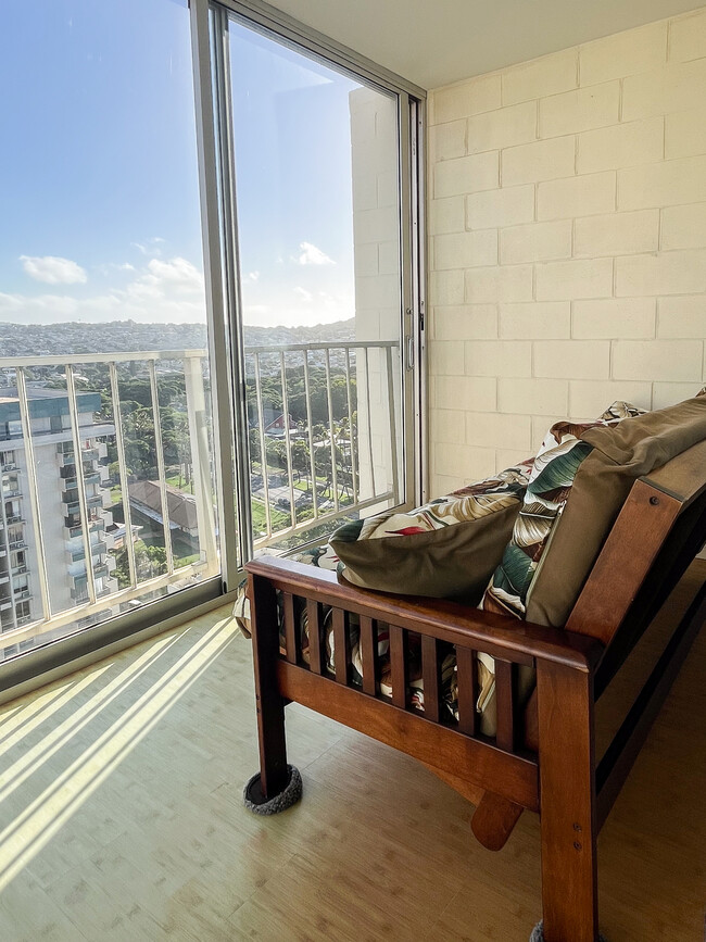 Glass enclosed lanai with Futon couch - 2575 Kuhio Ave