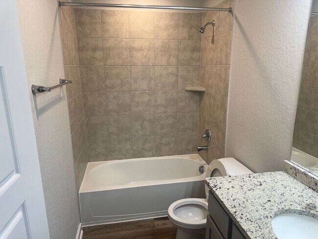 Building Photo - Stylish, Spacious & Close to It All – Your Ideal Townhome Awaits!