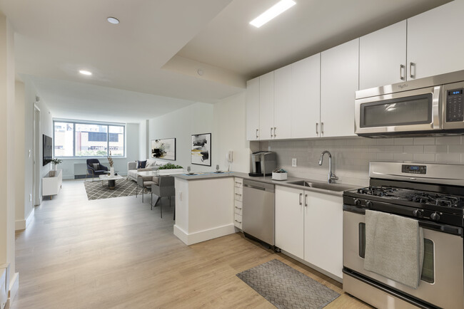 Renovated II North/South kitchen and living room with hard surface flooring - Avalon Clinton