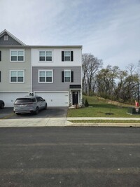 Building Photo - Modern end unit with deck, patio, open des...