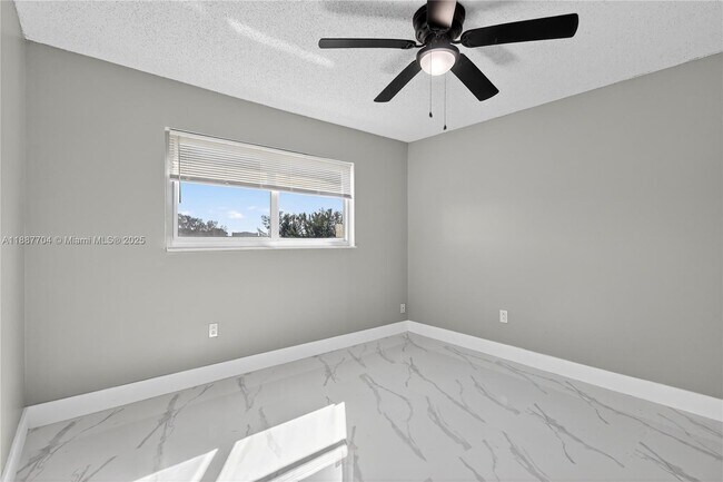 Building Photo - 9915 W Okeechobee Rd