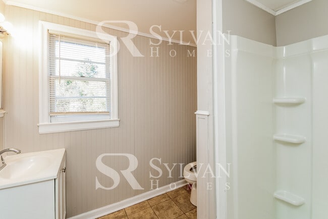 Building Photo - The living is easy in this 3 bedroom, 2 bathroom brick home