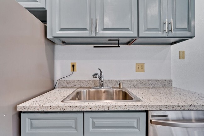 Building Photo - Spacious condo available in desirable Newpark Village community!