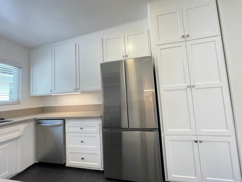 Stainless Steel Samsung Refrigerator and dishwasher - 7855 W Manchester Ave