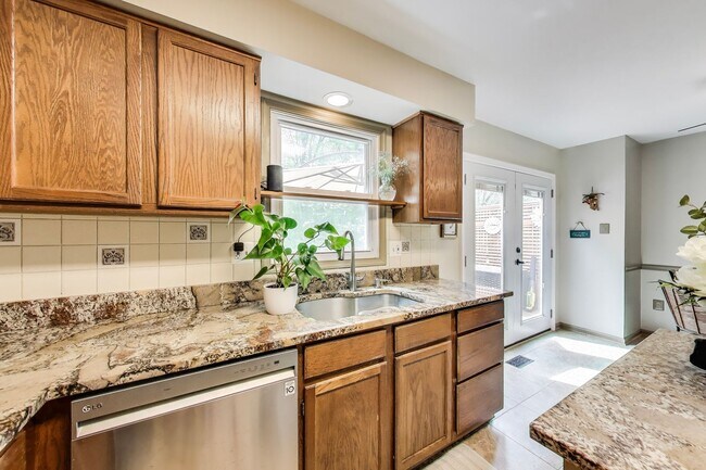 Building Photo - COMINGS SOON - Beautifully Updated Winchester-Built Townhome Backing to Serene Parkland.