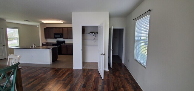 Kitchen, dining/linen closet, & half bath - 7583 Tuscan Bay Cir