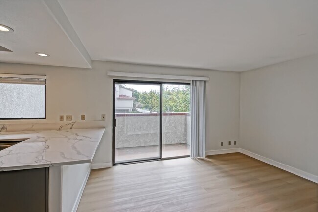 Building Photo - PRIME POOLFRONT LOCATION & CLOSE TO MAIN GATE! BRIGHT & SPACIOUS, END-UNIT POOLFRONT TOWNHOUSE W/...