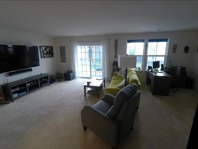 Family room, rear exit to back patio, space for home office or library - 8828 Englewood Farms Dr