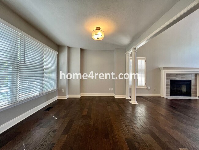 Building Photo - Maintenance Free Living w/ Hardwood Floors, Open Layout, Granite Counters, Finished Basement!