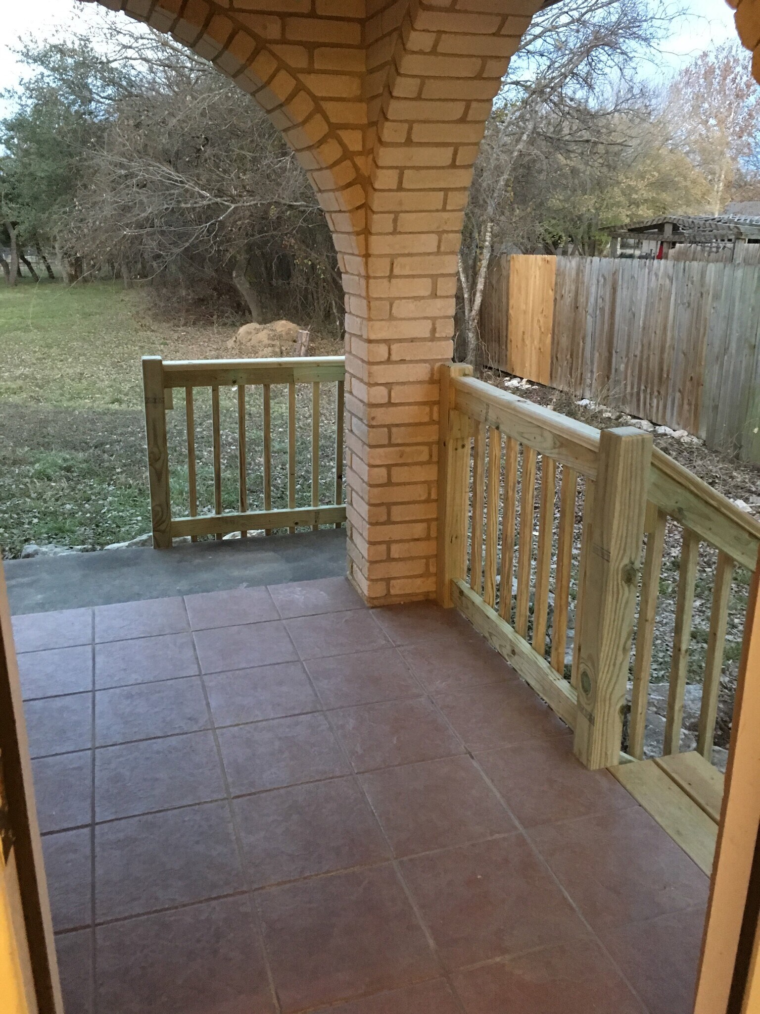 Fenced porch with steps into back yard - 1000 Ranchero Road