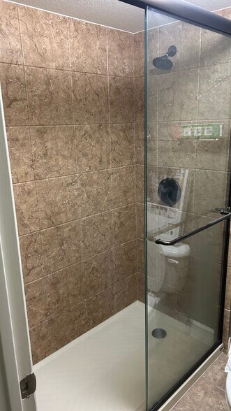 Master 1 has a beautiful walk-in shower - 3825 E Camelback Rd