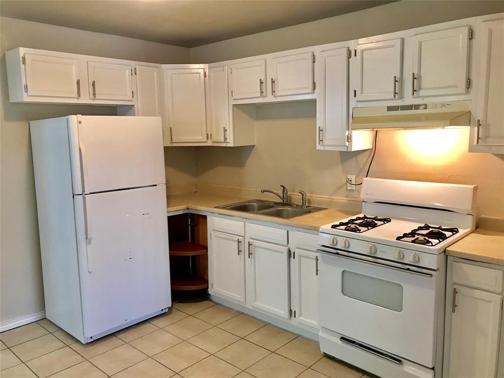 Kitchen, refrigerator and stove included. - 114 28th St N