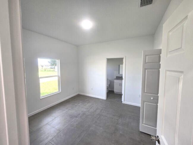 Building Photo - Brand-New 2/2/1 -SW Lehigh Acres-See this ...