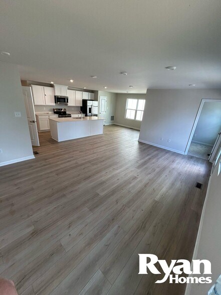 Spacious living and dining area with office space with a door, composite deck and 1/2 bath - 134 Grove Hill Ter