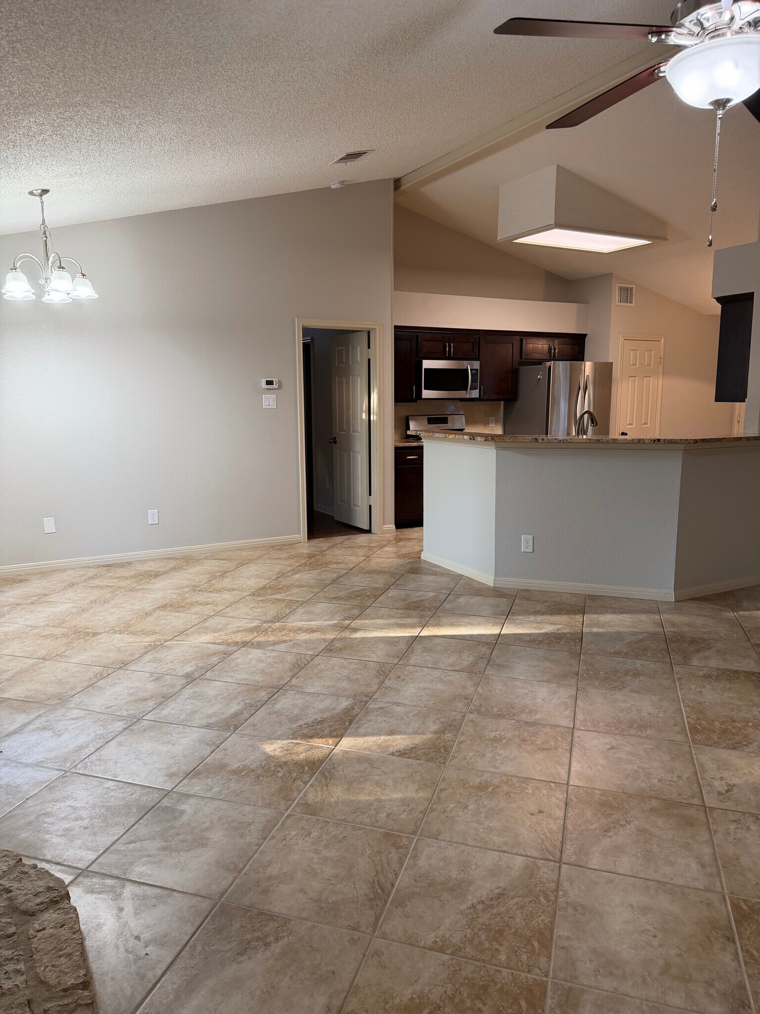 Kitchen bar and living area - 3209 Pepper Grass Trail