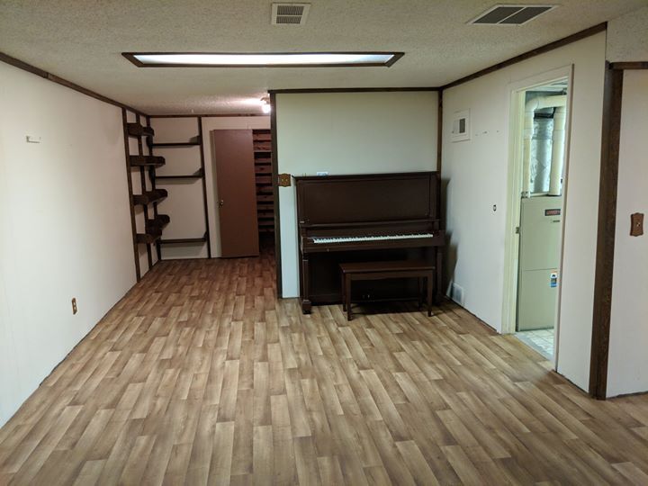 Basement open area with piano - 28 James Circle