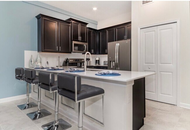 Building Photo - BEAUTIFUL CHAMPIONS GATE 2 BED 2 BATH COND0  w/GARAGE - FULLY FURNISHED - 12 MONTH RENTAL