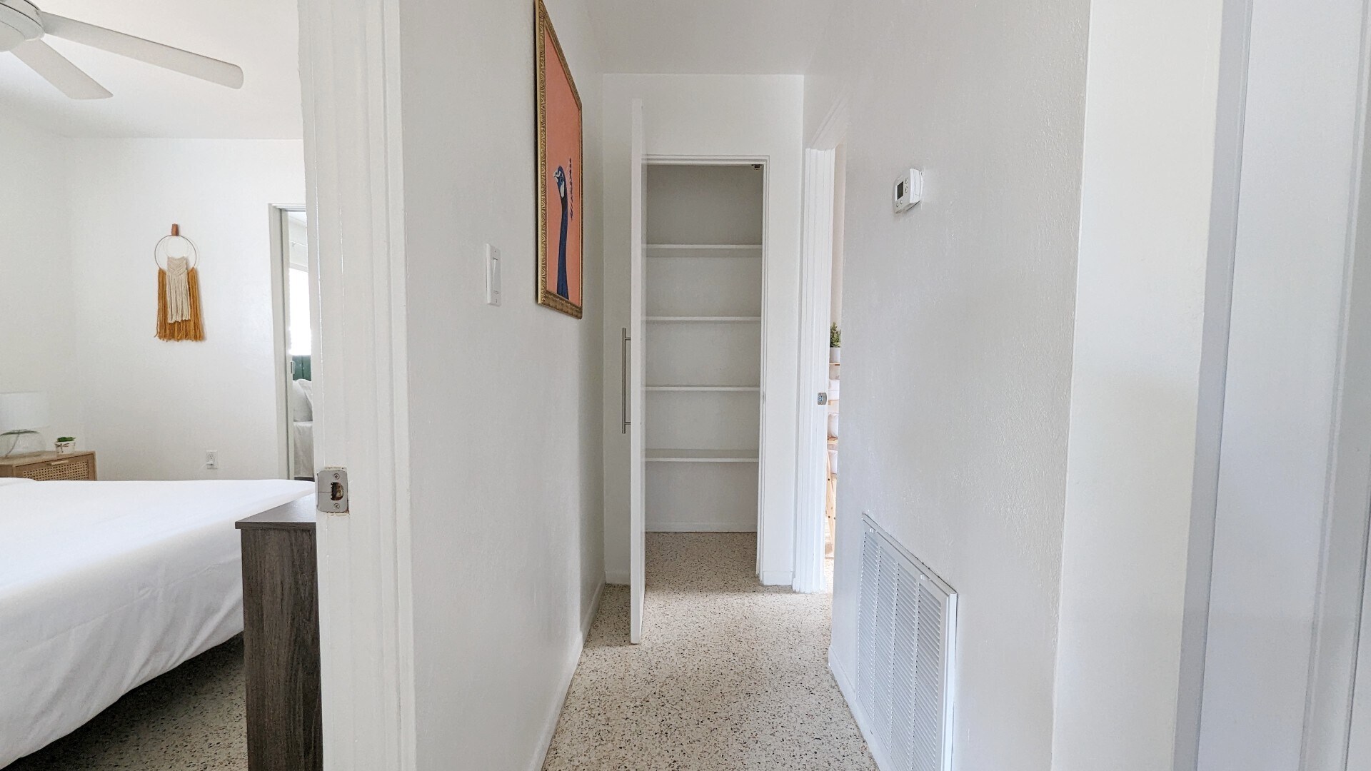 Hallway leading to bedroom and bathroom, containing additional storage - 2846 W Tamiami Cir