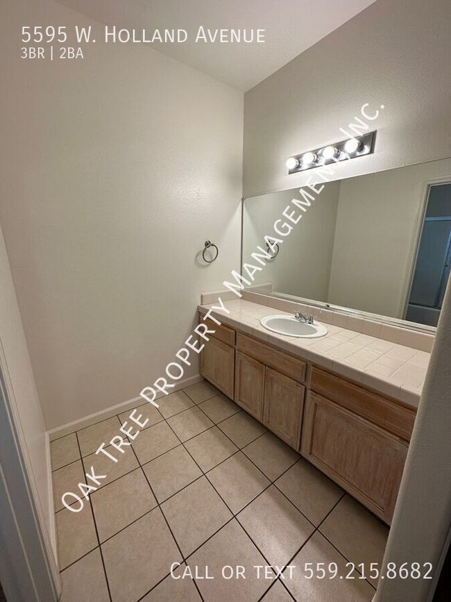 Building Photo - 5595 W Holland Ave